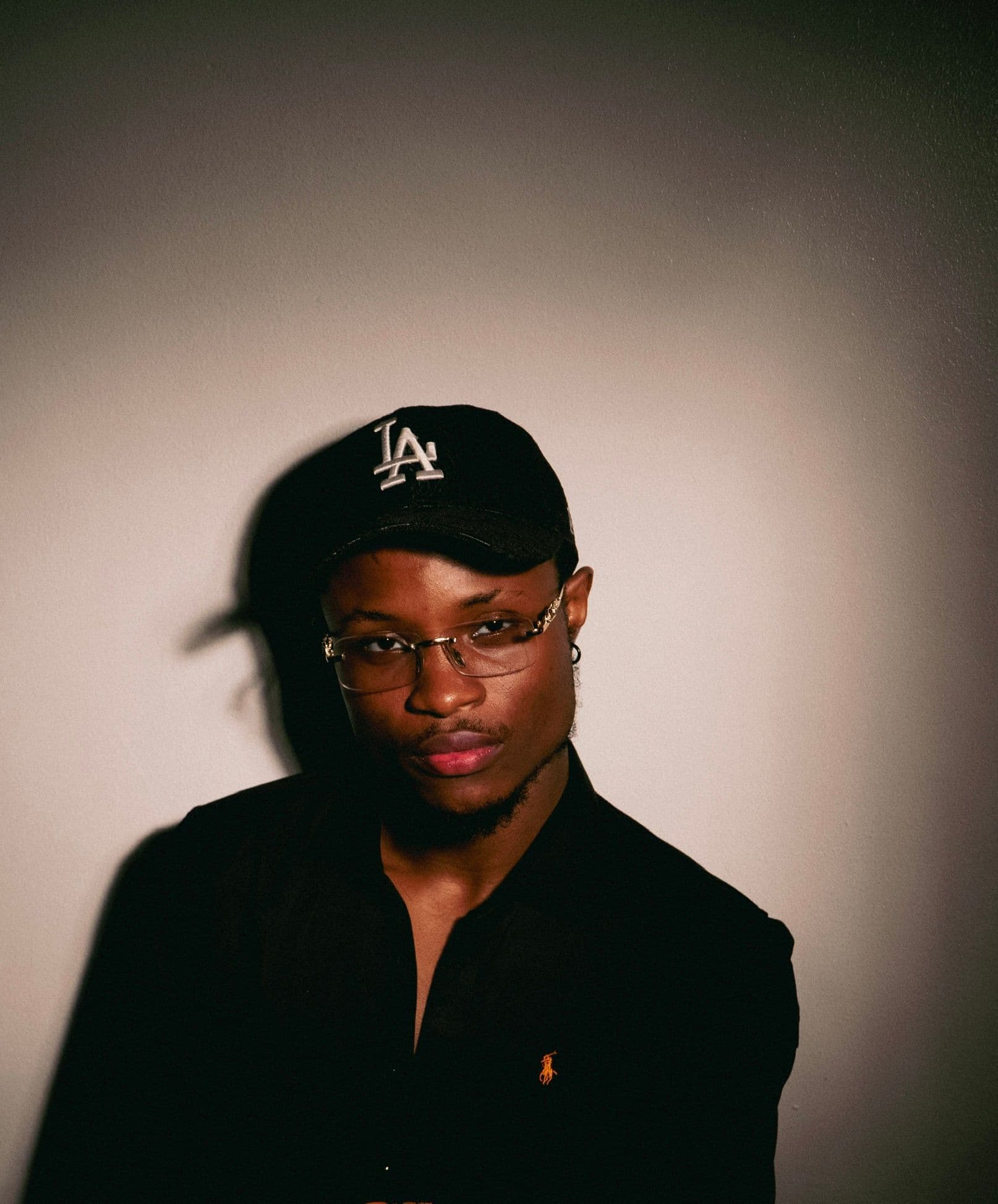 Moses Nwigberi in an LA cap and glasses
